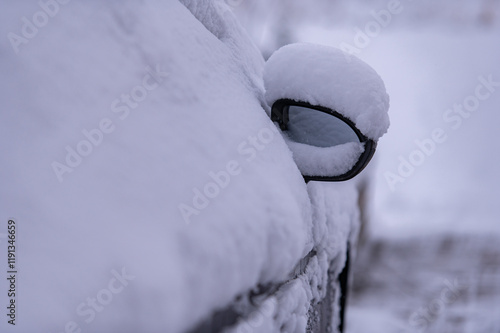 Car stuck in a snowdrift after blizzard. photo