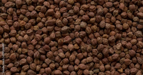 Top view of organic kala chana or brown chickpea.  Background texture, table spin. 