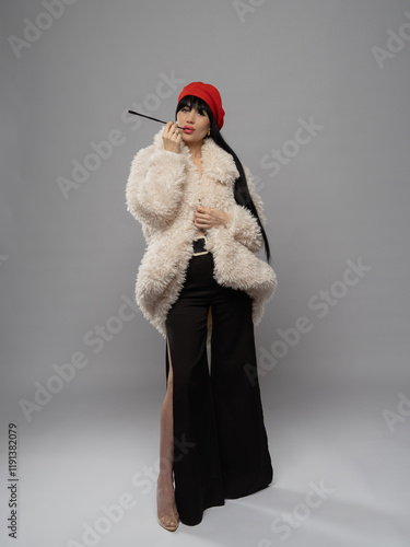 A modern, stylish, slim woman in a white fur coat, brunette with long hair, wearing a red beret. Elegant fashion photography. photo