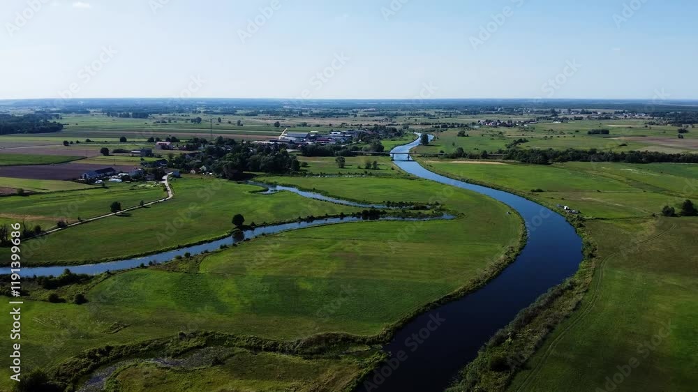View of a Beautiful Winding River at Sunset Surrounded by Green Fields Drone Aerial 4K Slow Motion View of a Beautiful Winding River at Sunset Surrounded by Green Fields Drone Aerial 4K Slow Motion