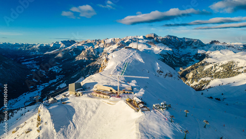 The Stazione di Arrivo Funivia Campitello and the Forcella del Sassolungo stand out in the breathtaking Val di Fassa ski resort in winter time captured by drone