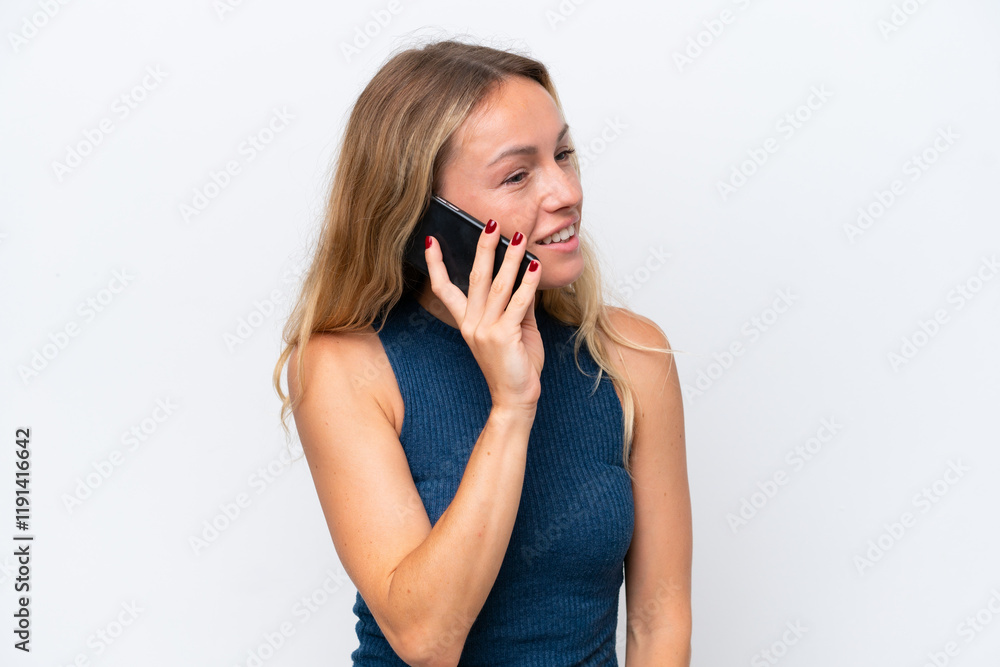 Young Russian woman isolated on white background keeping a conversation with the mobile phone with someone Young Russian woman isolated on white background keeping a conversation with the mobile phone with someone