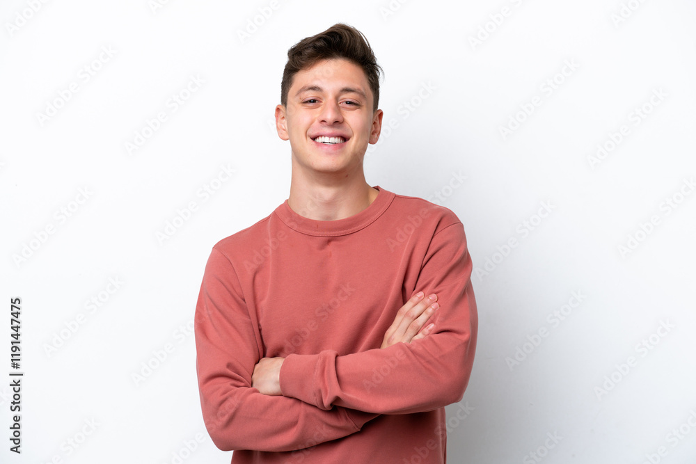Young handsome Brazilian man isolated on white background keeping the arms crossed in frontal position Young handsome Brazilian man isolated on white background keeping the arms crossed in frontal position