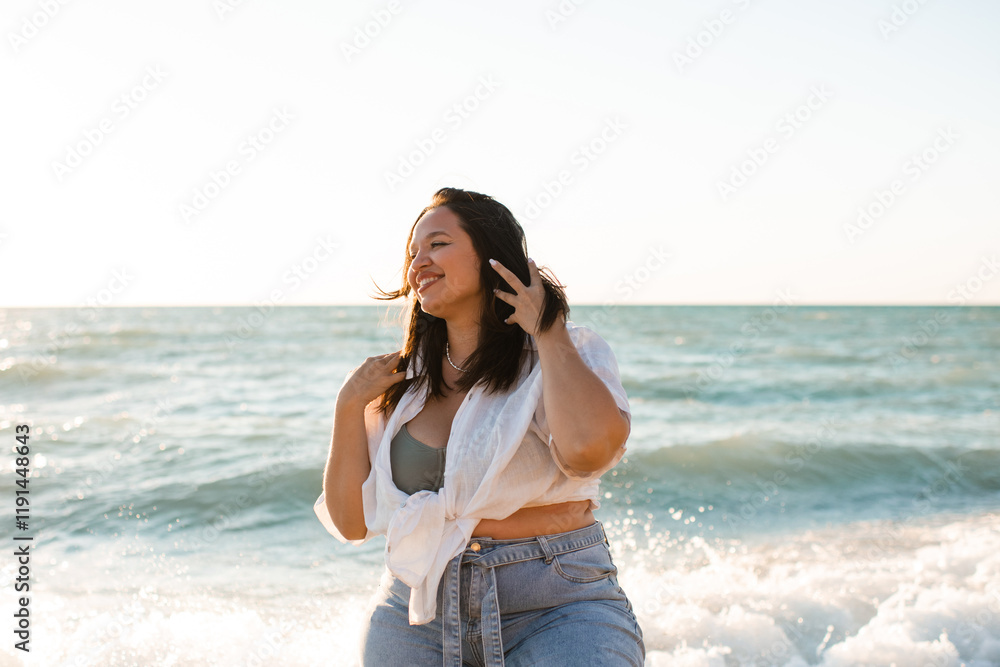 Happy young adult woman 30-35 year old having fun over sea at beach outdoor. Summer time. Vacation season. Happy young adult woman 30-35 year old having fun over sea at beach outdoor. Summer time. Vacation season.