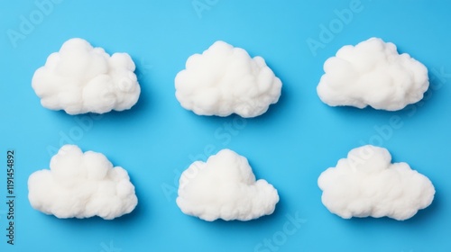 Cloud Nine: Six fluffy white clouds arranged in a grid against a vibrant blue background, symbolizing a sense of lightness, airiness, and boundless possibilities. photo