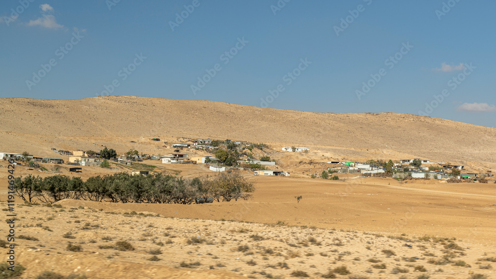 Primitive Bedouin dwellings and animals in the Negev Desert in southern Israel.
