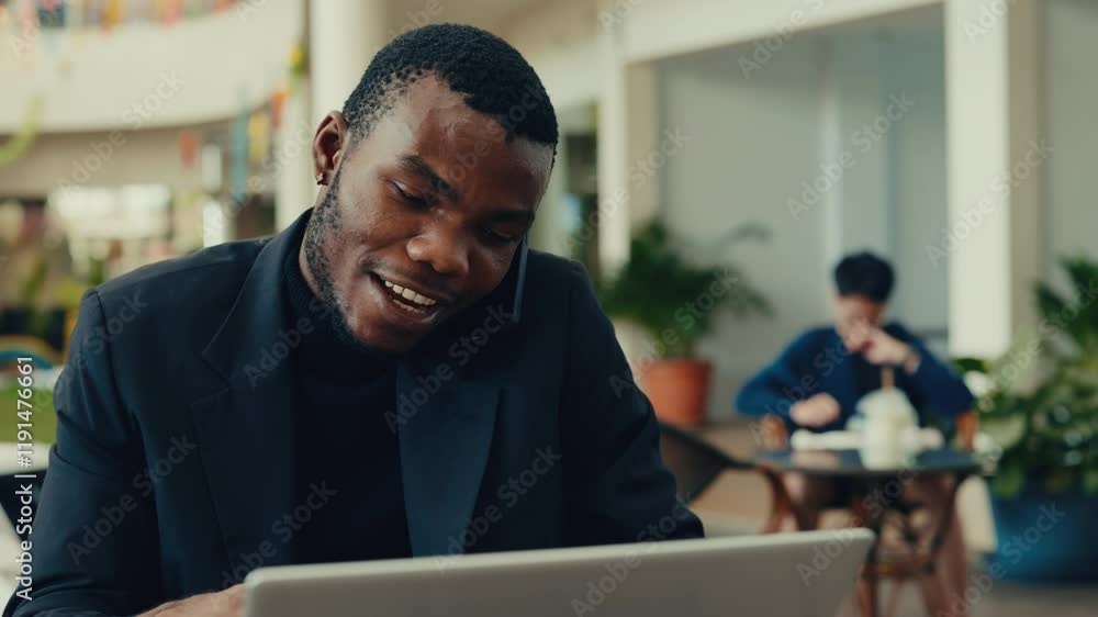 custom made wallpaper toronto digitalPortrait of African American business man nodding head while speaking on phone in cafe