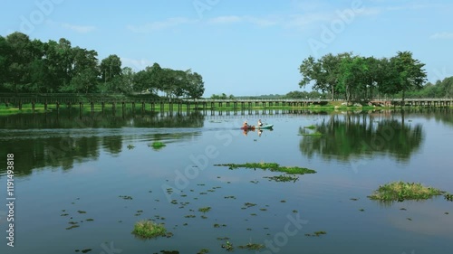 Rowing a Boat on a Stunning Lake with Scenic Landscape lake in the park