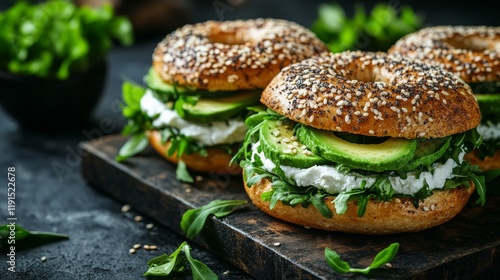 Delicious bagels filled with fresh vegetables and creamy cheese at a rustic k...