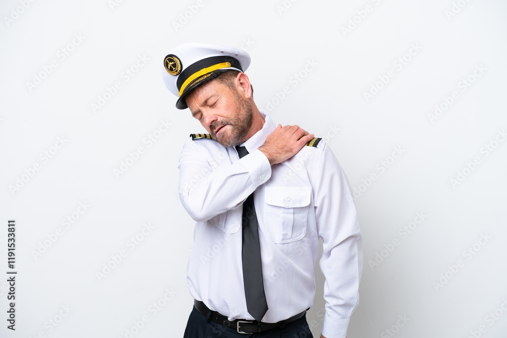 Airplane middle age pilot isolated on white background suffering from pain in shoulder for having made an effort Airplane middle age pilot isolated on white background suffering from pain in shoulder for having made an effort