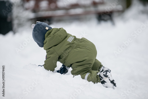 Wallpaper Mural Small toddler boy playing in winter snow having great time of excersise in fresh air Torontodigital.ca