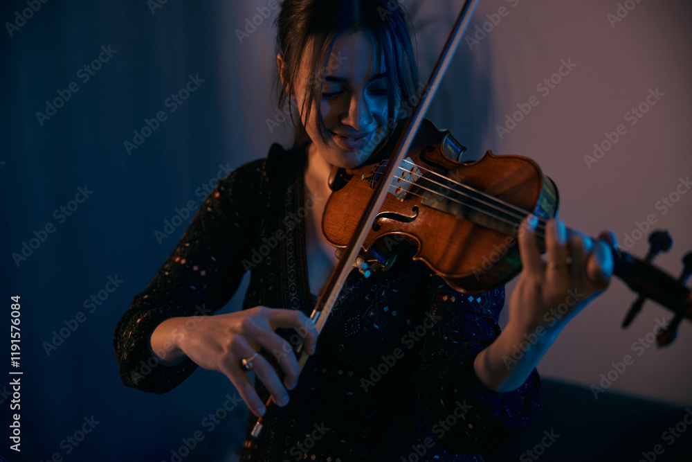 Fototapeta premium Female Violinist is Preparing for a Concert