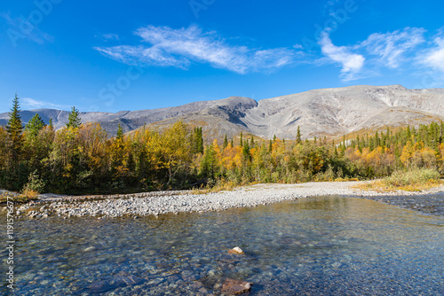 Obraz na płótnie Scenic view of Khibiny mountains with North Chorrgor pass, forest and cold crystal water river Kuniyok. Kola Peninsula, Murmansk region, Russia. w salonie