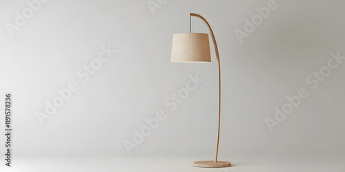 Elegant arc floor lamp with a beige fabric shade, perfect for adding a touch of modern style to any room. The minimalist design complements various interior styles. photo