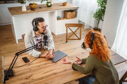 Canvas Print adult man host interviewer woman guest questions while record podcast