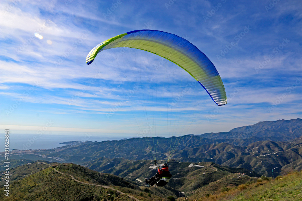 Paraglider flying from Itrabo, Spain Paraglider flying from Itrabo, Spain