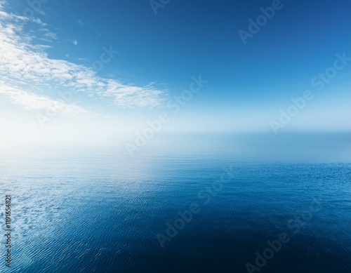 tranquil minimalistic scene with misty blue sky and calm water for relaxation and serenity concepts photo