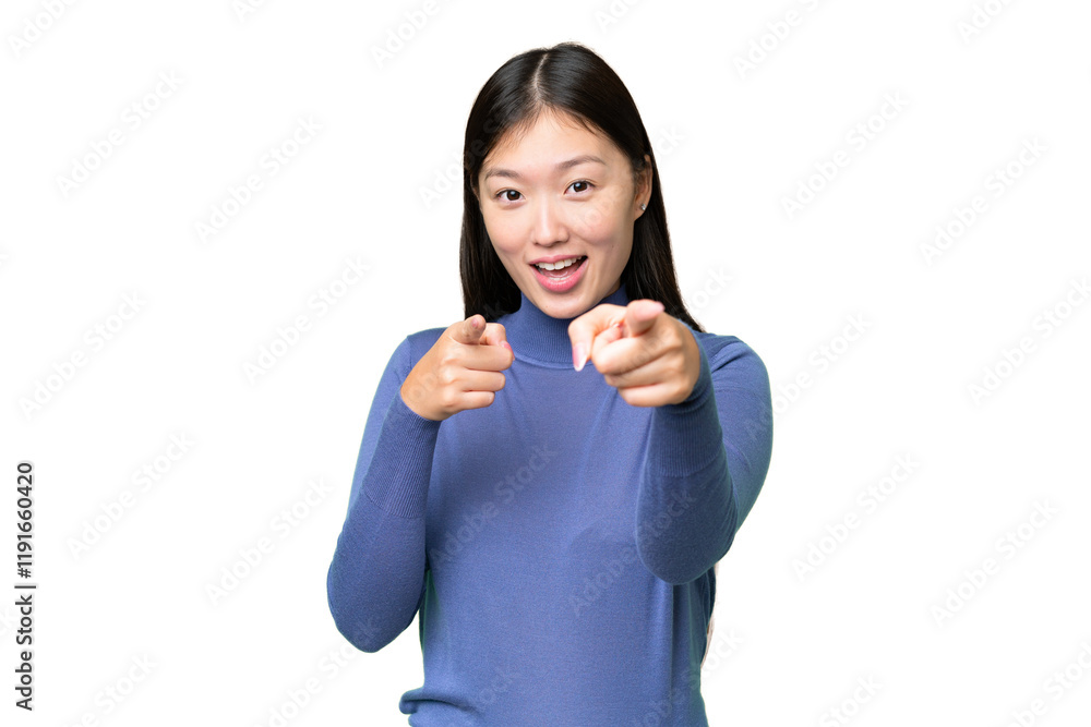 Young Asian woman over isolated chroma key background surprised and pointing front Young Asian woman over isolated chroma key background surprised and pointing front