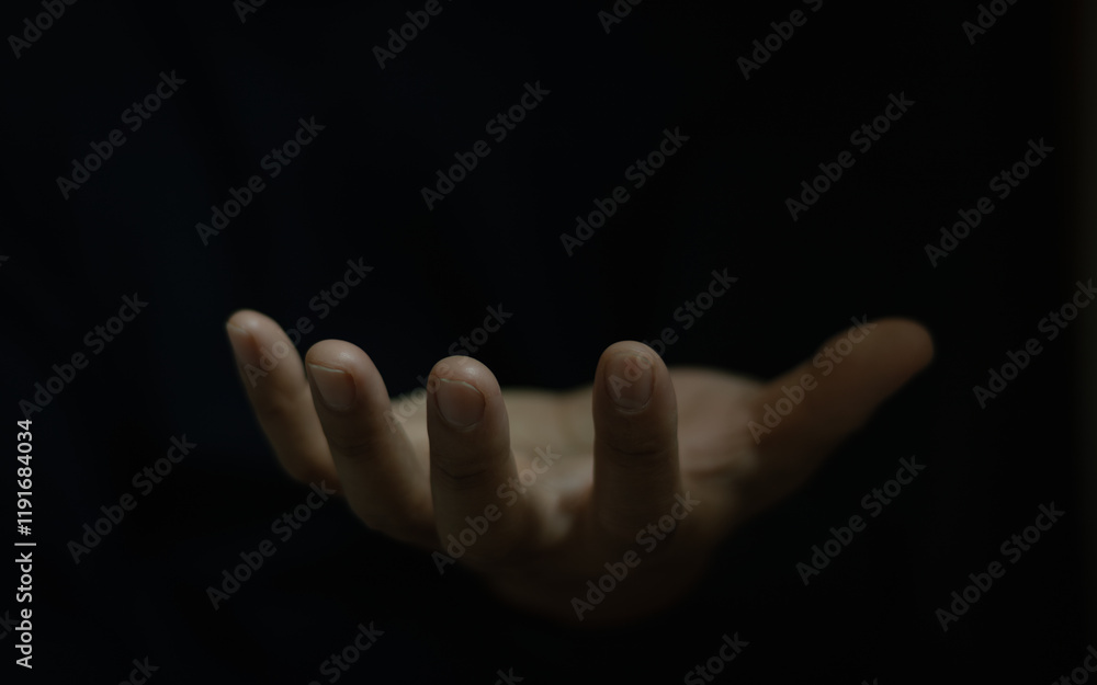 Open hand gesture, isolated on black background. Praying hands with faith in religion and belief in God on blessing background. Power of hope or love and devotion. Man hand hold hope help support. Open hand gesture, isolated on black background. Praying hands with faith in religion and belief in God on blessing background. Power of hope or love and devotion. Man hand hold hope help support.