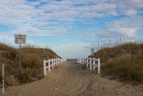 Path to the beach and ocean with a picket fence