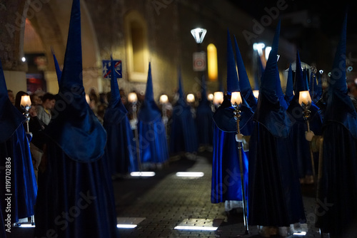 Nazarenes in blue, with a lantern and a candle, to illuminate the streets of Cartagena, in the Holy Monday procession photo