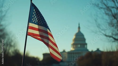 a close-up of the American flag gently waving in the wind, with the U.S. Capitol building in the blurred background under a clear blue sky