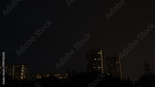 Thunderstorm Lightning strikes high rise apartment building. Dark night sky. 4K Resolution.
