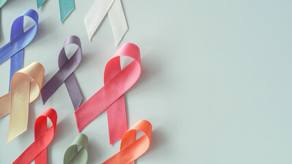 all ribbons on blue background, world cancer day, World Autism Awareness Day, autism spectrum, handicap and pride concept