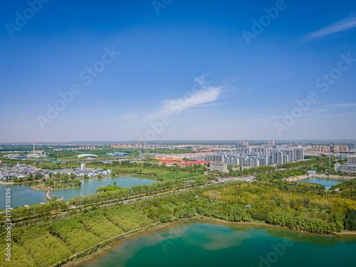 Vibrant spring and summer landscape in Yinchuan Ningxia showcasing lush greenery and urban development photo