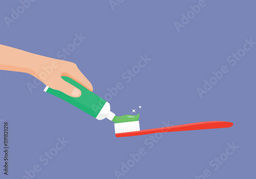 Hand squeeze toothpaste on toothbrush from a tube
