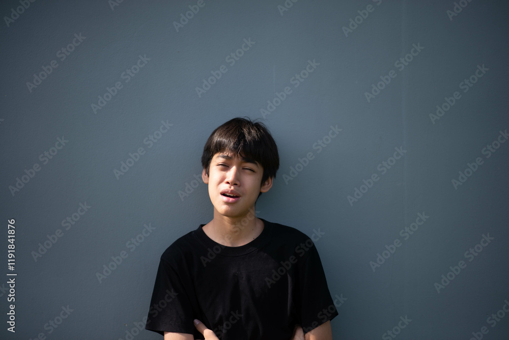 Fototapeta premium Teenage Boy's Expressions Collage: A captivating grid showcases a young Asian boy's diverse facial expressions, capturing a range of emotions from joy to contemplation.