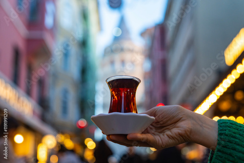 Turkish Tea (Türk Çayı) Photo in Front of Istanbul Symbol Galata Tower, Galata Tower Beyoglu, Istanbul Turkiye (Turkey) photo