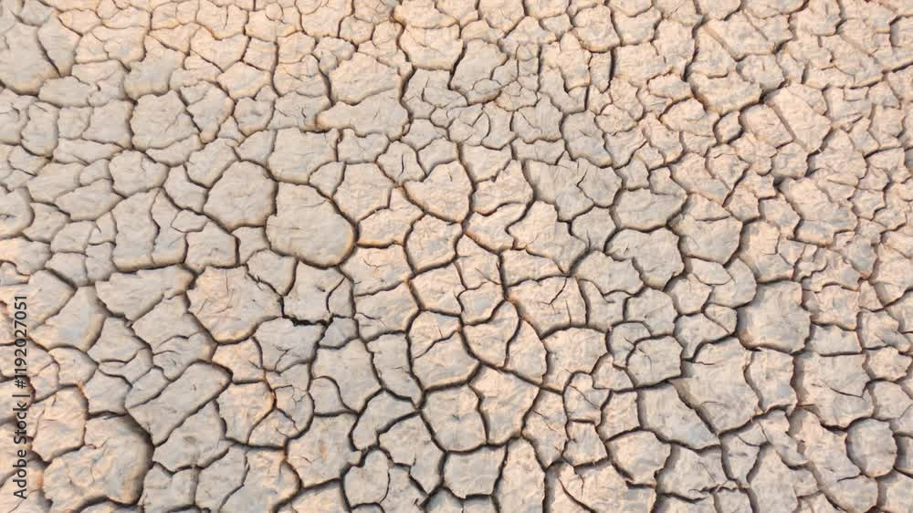 Draught land of Kutch desert. Natural pattern of desert land. Cracked, dry soil due to lack of water and hot weather in Little Rann of Kutch, Gujarat. Dehydrated and barren land during summer season
Draught land of Kutch desert. Natural pattern of desert land. Cracked, dry soil due to lack of water and hot weather in Little Rann of Kutch, Gujarat. Dehydrated and barren land during summer season