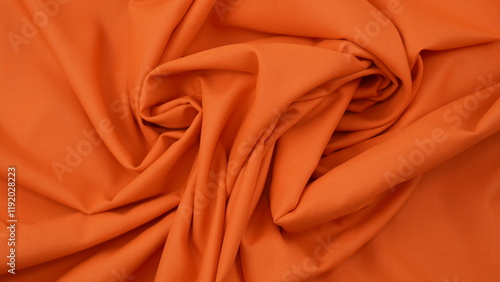 Close-up of orange cotton fabric showing a detailed woven texture, soft natural fibers, and a smooth textile surface perfect for design or background use.
