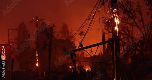 Altadena, California, USA - January 8, 2025: Power lines destroyed by the Eaton Fire hang in a residential neighborhood.
