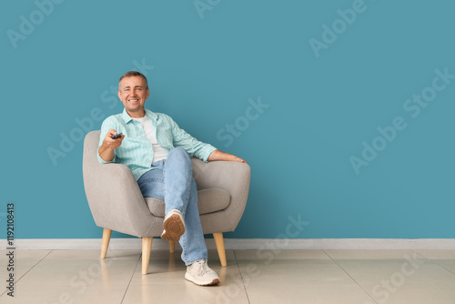 Relaxed man watching televi...