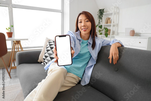 Young Asian woman with smar...