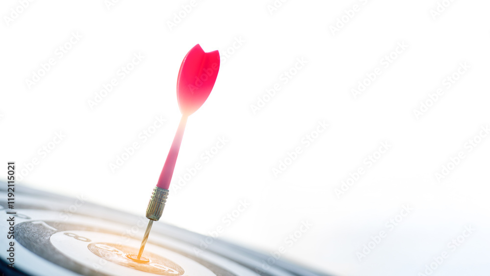 Business marketing Goal-oriented thinking is successful concept. Red dart arrow hitting in the target center of dartboard Target hit in the center. Business marketing Goal-oriented thinking is successful concept. Red dart arrow hitting in the target center of dartboard Target hit in the center.