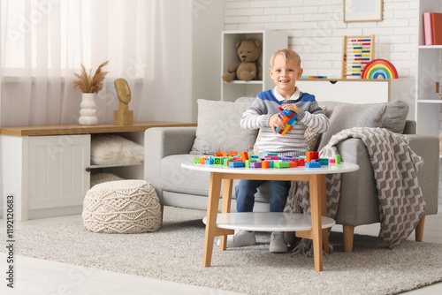 Happy cute little boy playi...