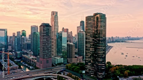 Establishing shot of Chicago, Illinois. The camera pans along the skyline at sunset.