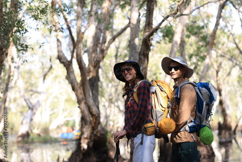 Wallpaper Mural Couple backpackers travel in the forest Use binoculars while hiking. Torontodigital.ca