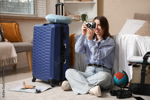 Female traveler with photo ...