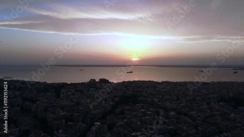 Thessaloniki Greece City Center Aerial Crane Shot, Thermaikos, Golden Hour Backlit View at Dawn photo