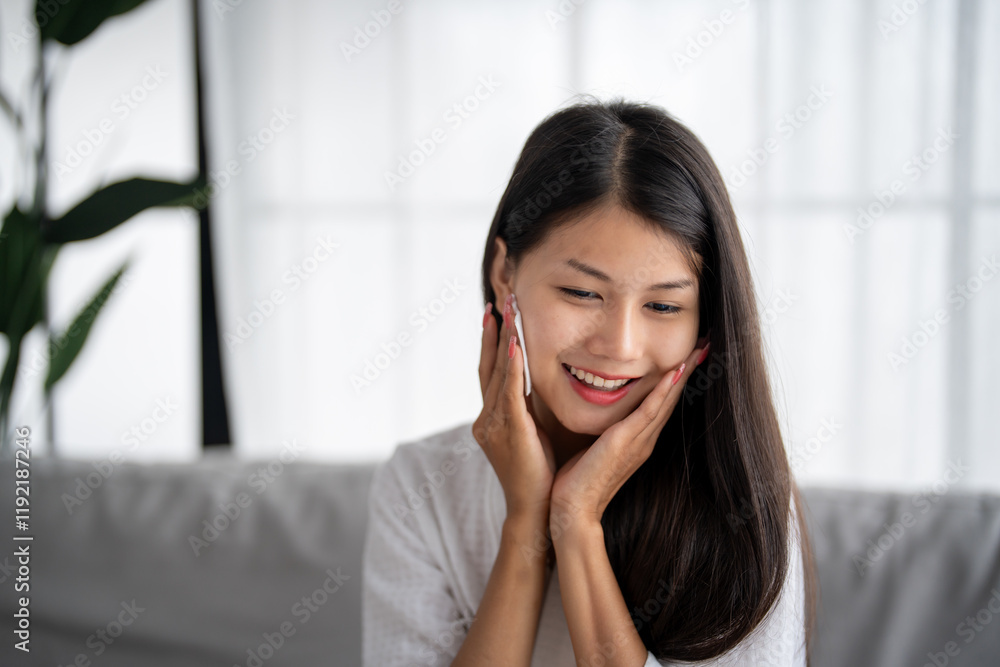Daily beauty routine Asian woman.with clean skin uses micellar water to remove makeup Daily beauty routine Asian woman.with clean skin uses micellar water to remove makeup