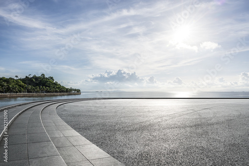 Canvas Print Empty asphalt road by the sea with sky background