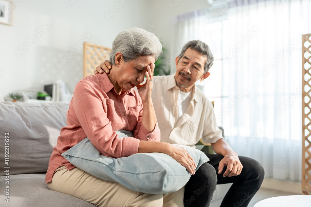 Obraz premium Asian elderly husband comforting upset wife crying with tears for problem.