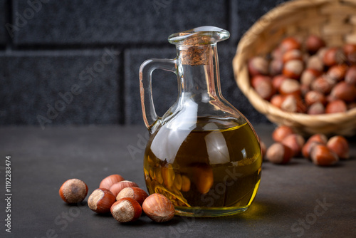 Peanut oil in glass bottle and peanuts
