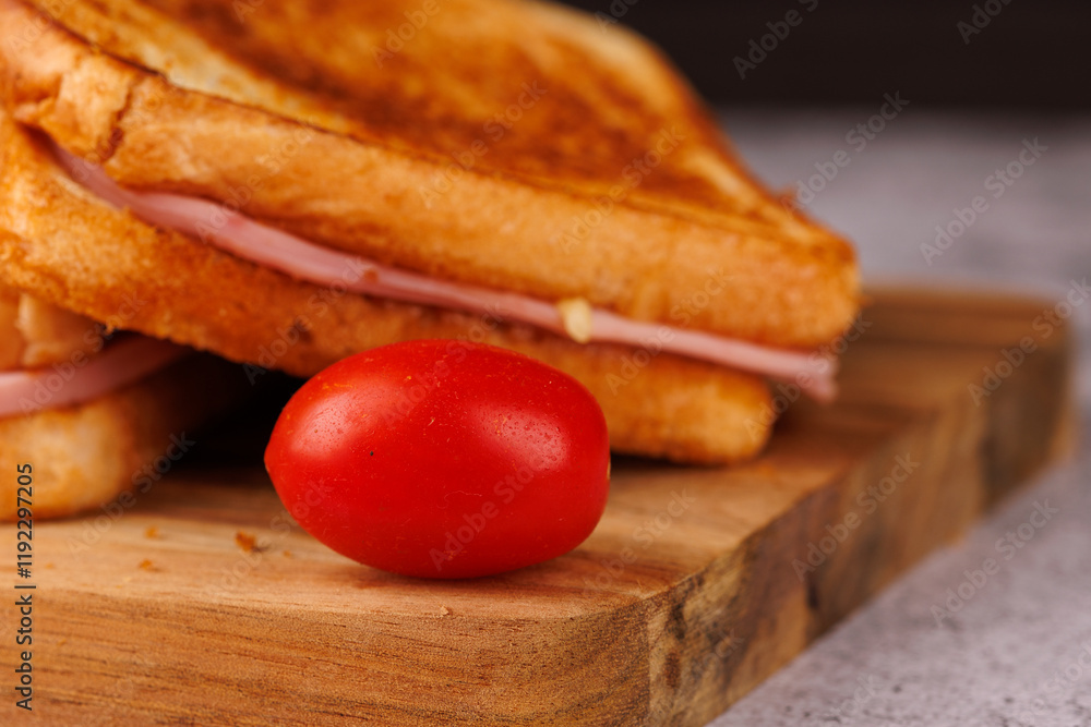 Appetizing Sandwiches and Cherry Tomatoes with a Red Napkin on a Black Background Appetizing Sandwiches and Cherry Tomatoes with a Red Napkin on a Black Background