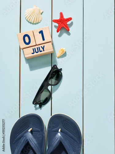 Beach accessories, flip flops and sunglasses celebrating first day of july photo