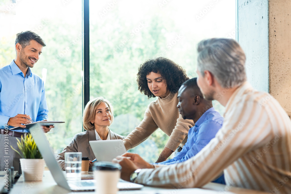 Business team discussing together business plans in office. Business team discussing together business plans in office.